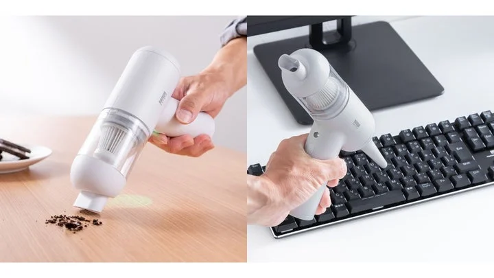 ハンディクリーナーとしてデスク上のゴミを吸引し、エアダスターとしてキーボードを清掃する様子
