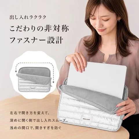 ノートパソコンを出し入れしている非対称ファスナーの様子