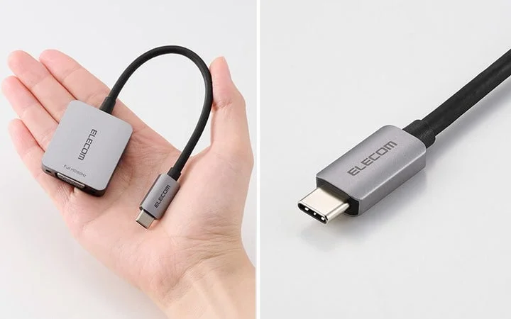 手に持ったアダプターとコネクタ部分のクローズアップ