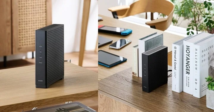 木製のテーブルに設置された黒いWi-Fiルーター