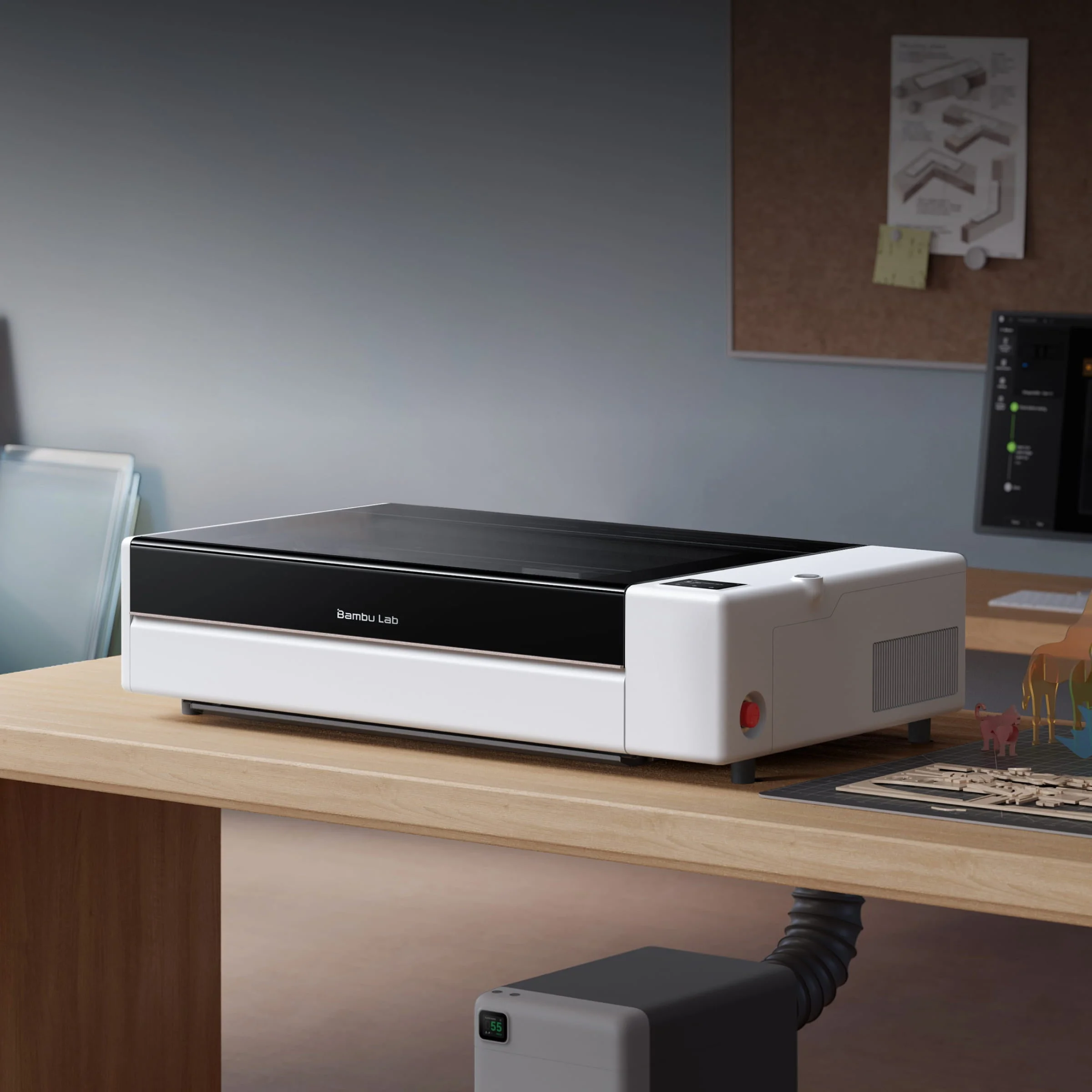 Bambu Lab R1のデスクトップ設置イメージ。レーザー加工機本体と排気装置が写る。