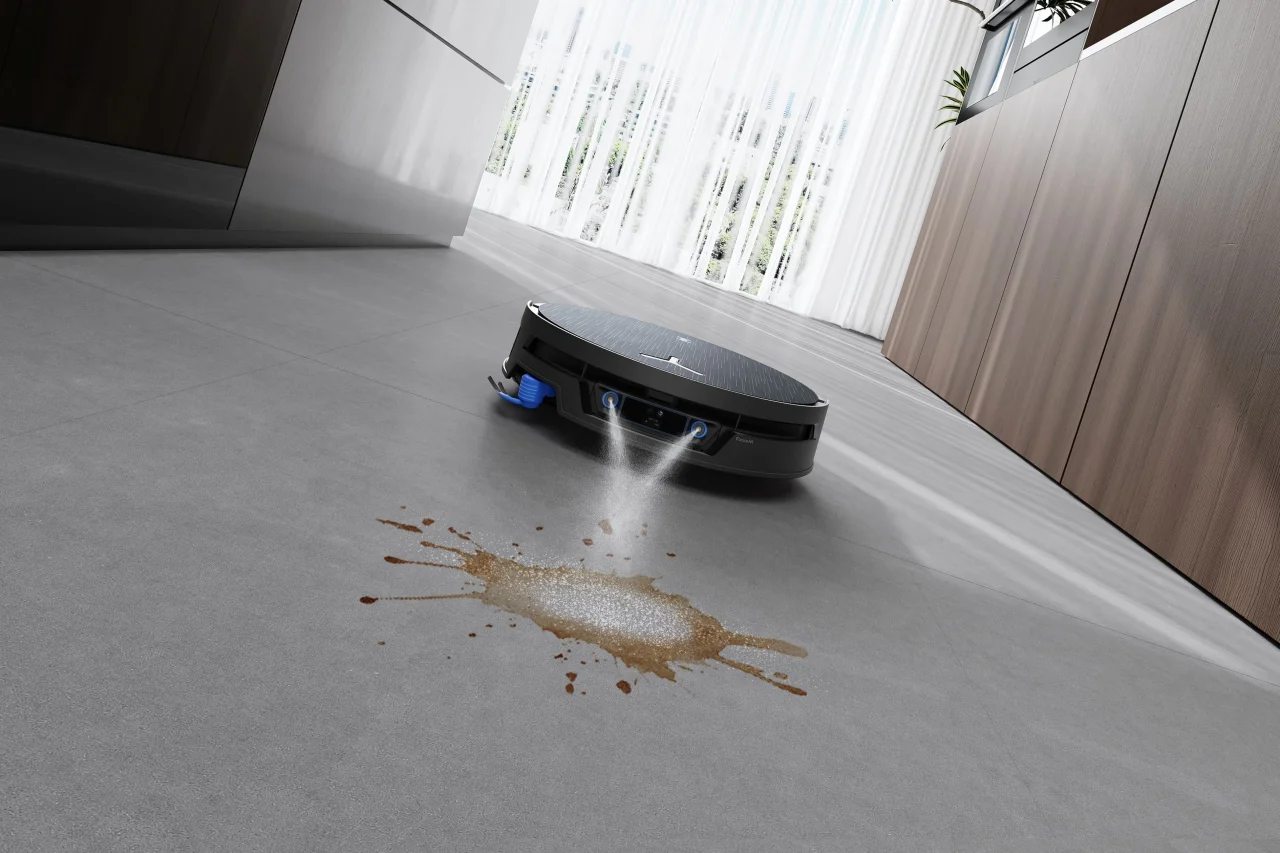 DEEBOT X12S PRO OMNIが床の汚れにFocusJet 2.0で水と洗浄液を噴射する様子