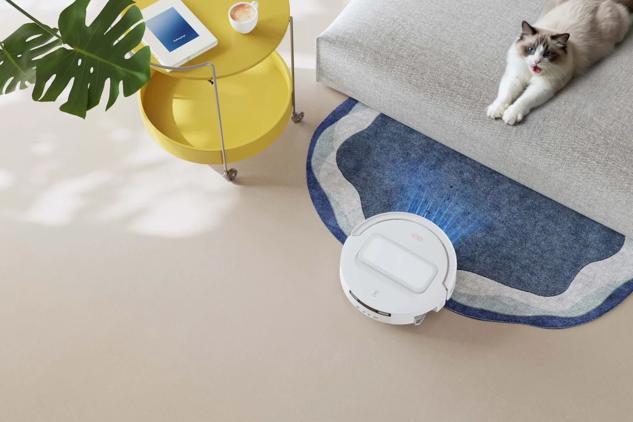 DEEBOT T90 MAX Familyのロボット掃除機がカーペット上で清掃する様子