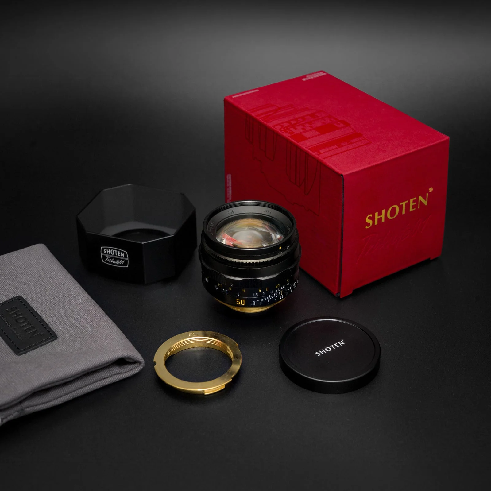 SHOTEN「TRIBUTE 01 - LTM50mm f/1.1」と付属品、赤い箱