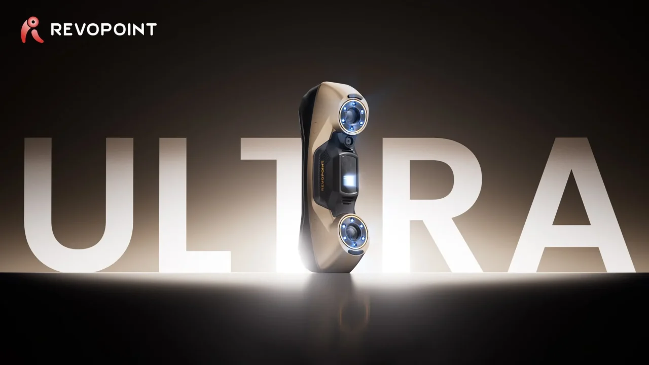 MetroY Ultra 3Dスキャナー。大きなULTRA文字を背景に立つ金色の本体
