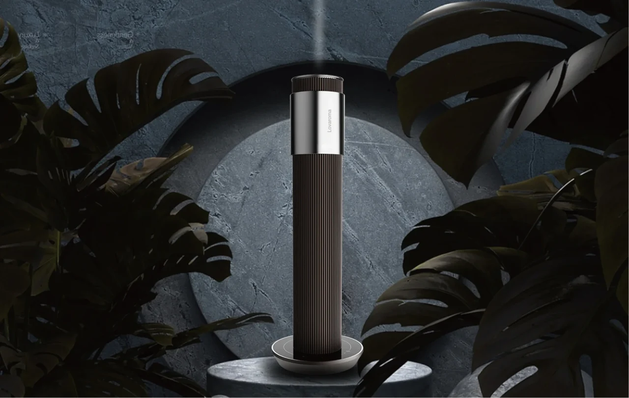 Lovaroma Core Diffuser Pro。観葉植物と石の台座に立つ筒型本体