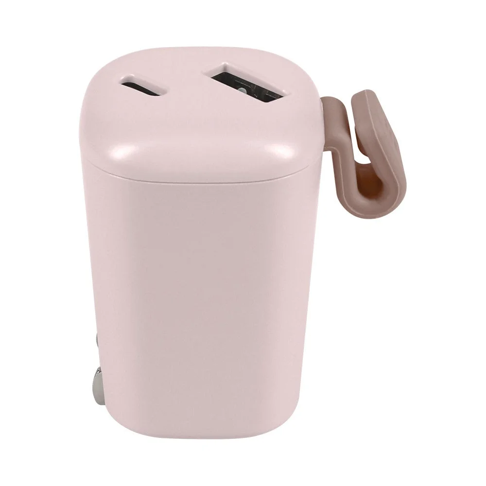 Easy Charger ピンクベージュ。上面にUSBポート2つと指掛けのある丸みの充電器