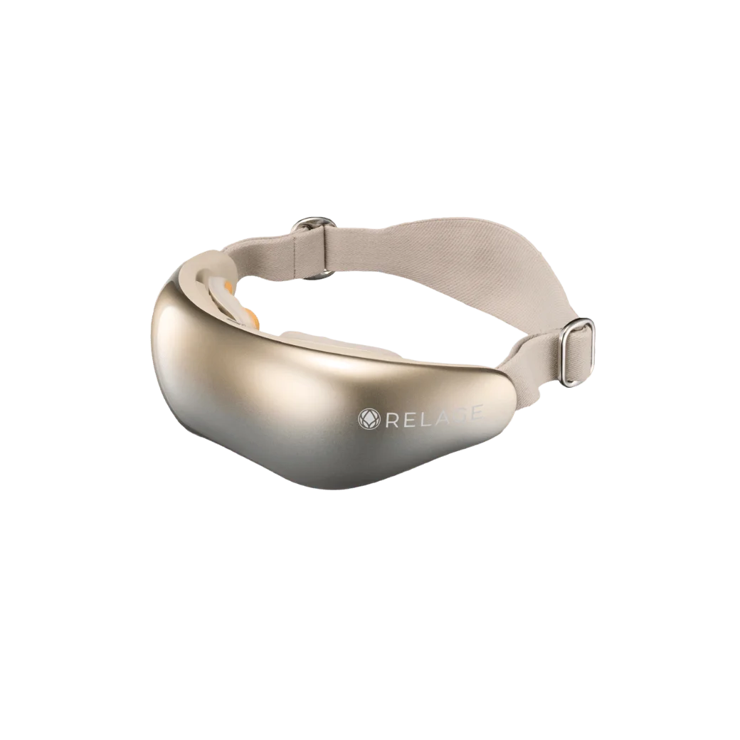 HEAT EyeCare Pro。金色の本体にベージュのバンドが付いた目元ケア機器
