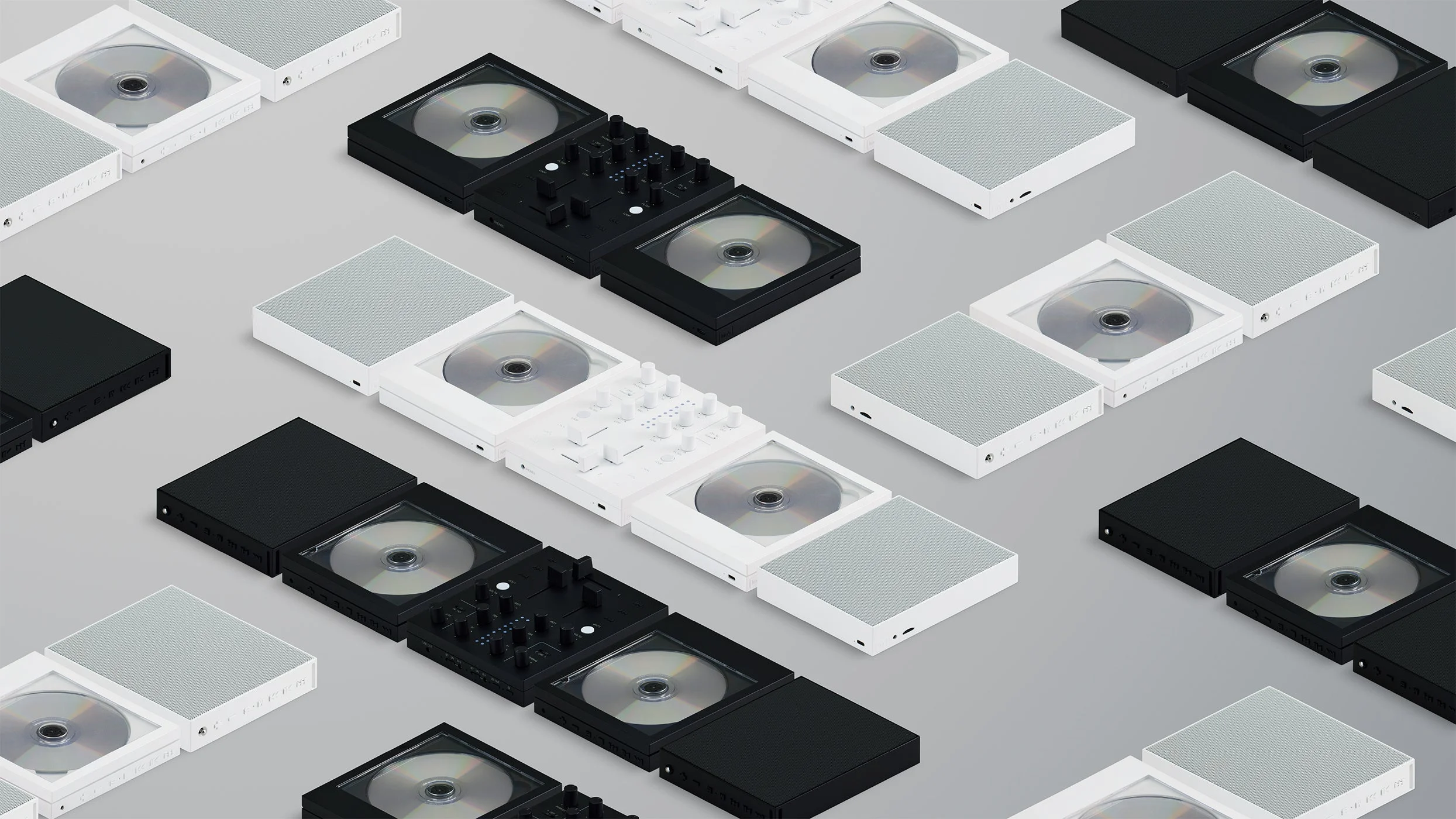 白と黒のCDプレーヤー、ミキサー、スピーカーを並べた配置