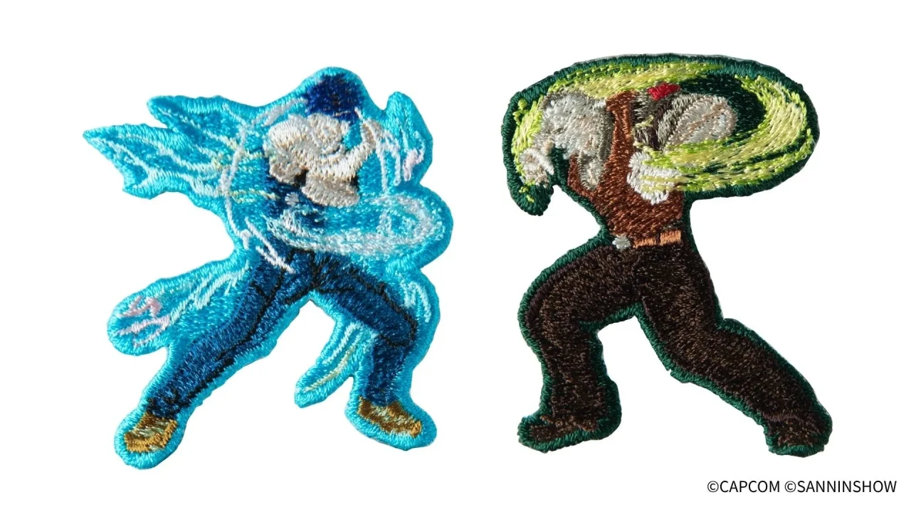 刺繍ステッカー2枚セット。青と緑の刺繍で表現した2人のキャラクター
